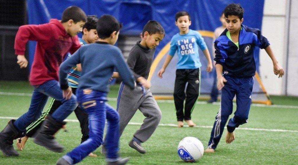 Syrian refugees playing football